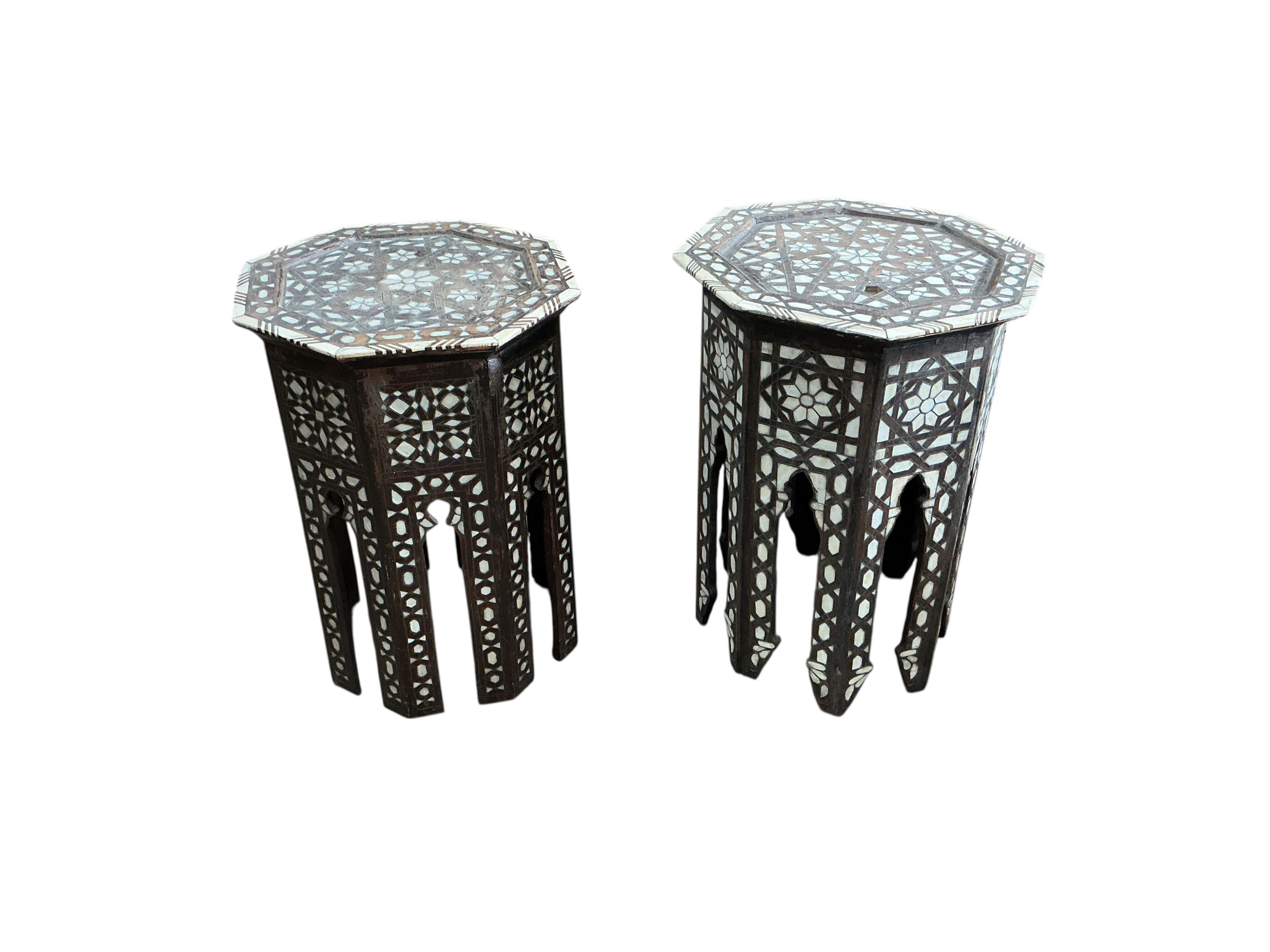 A near pair of octagonal bone inlaid Moorish occasional tables, width 39cm, height 55cm